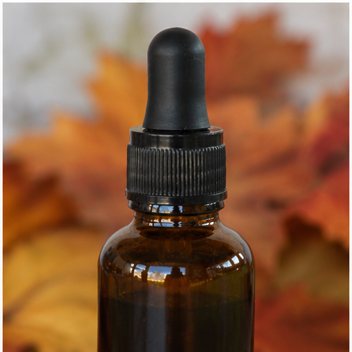 Gotero del producto para el cuidado de la piel 'Ageless' con fondo de hojas de otoño — NaturElle Puerto Rico