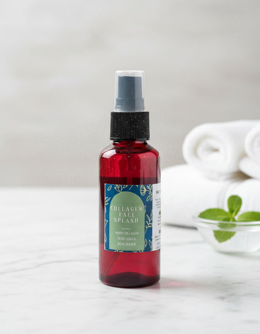 Naturelle Collagen Face Splash facial mist by D'Elle Gifts in a red spay bottle on a spa inspiration